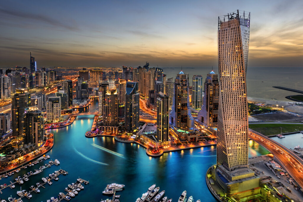 The tall buildings of Marina Bay in Dubai, the UAE during sunset